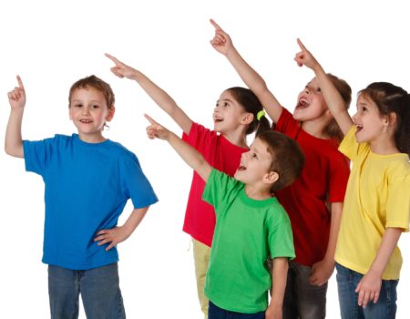 Group of happy children with pointing up sign, isolated on white