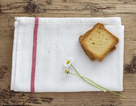 Toast and Daisy Flower on Wooden background. Rustic